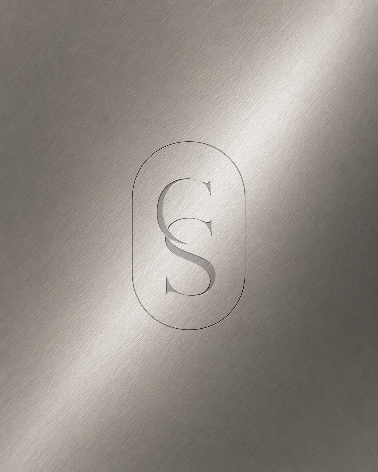 Chroma Studio CS monogram engraved in brushed chrome